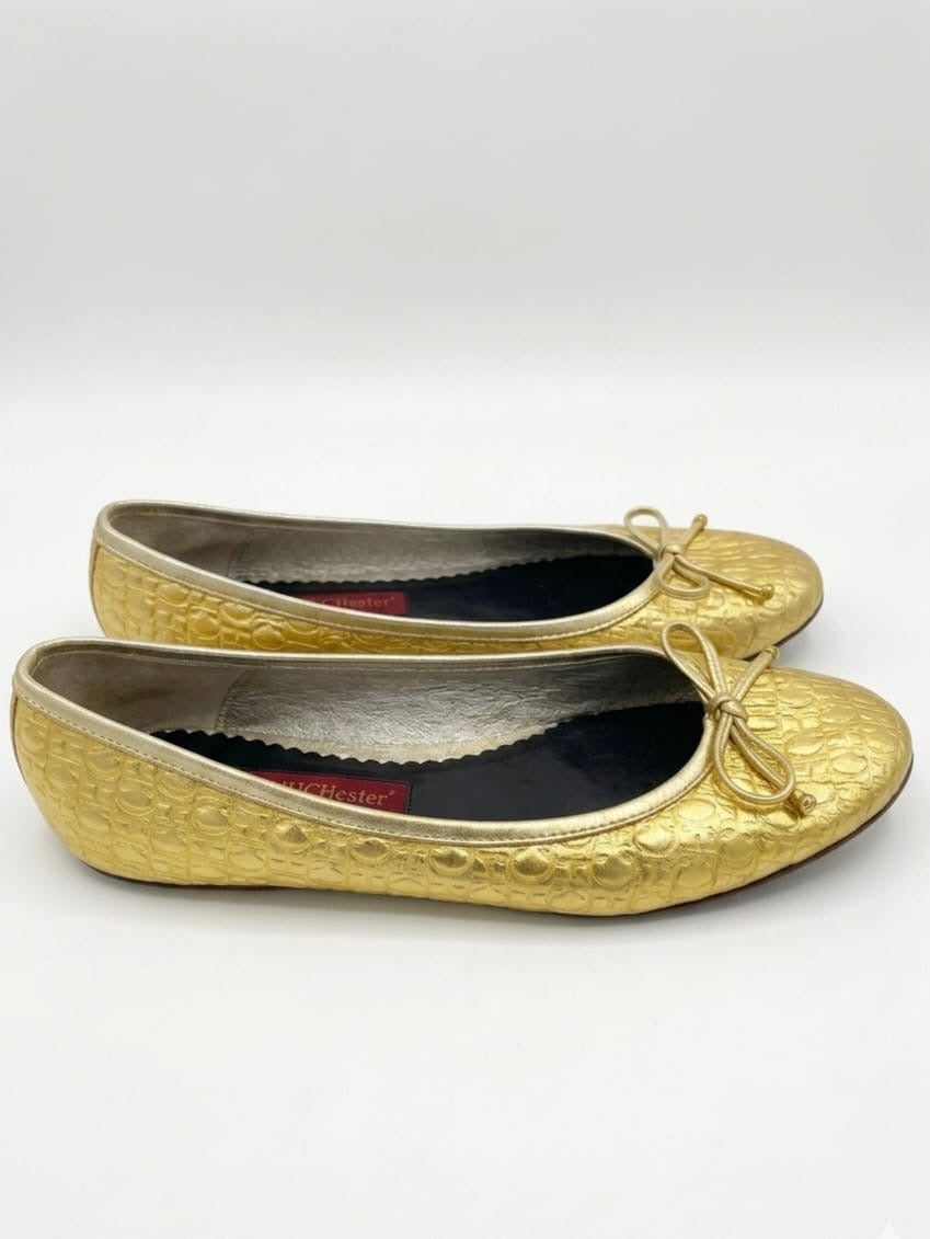Gold metallic monogram print ballet flats