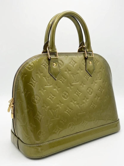 Vert Bronze Monogram Vernis Alma bag in a structured patent leathe