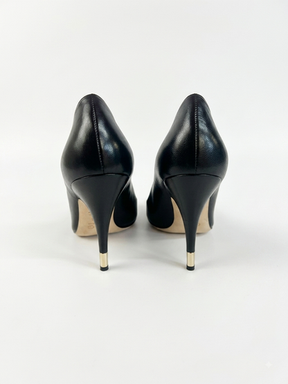 Black leather peep-toe pumps